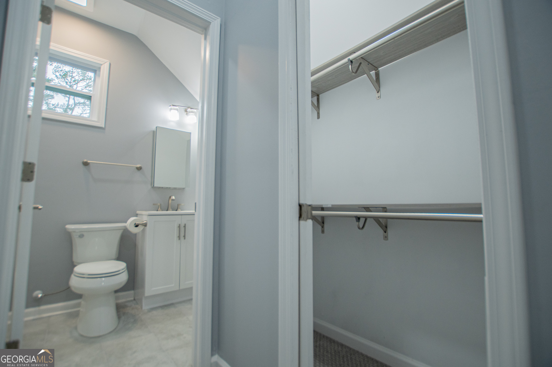 74 Jiles Road Carrollton, GA 30117 - Photo 76 of 130 a bathroom with a toilet a sink and view