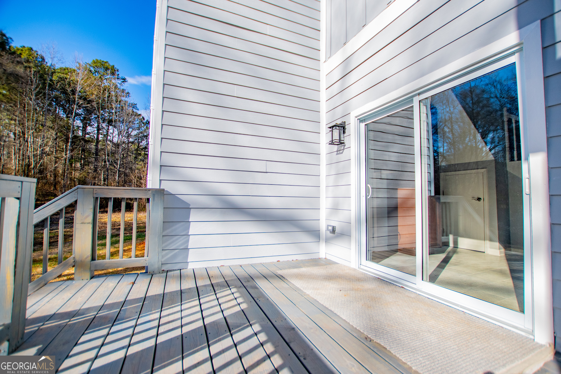 74 Jiles Road Carrollton, GA 30117 - Photo 96 of 130 a view of a balcony with a door and wooden floor