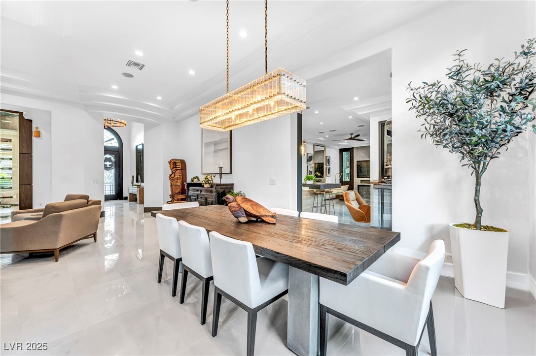 8032 Spring Buck Court Las Vegas, NV 89129 - Photo 11 of 41 Dining room featuring recessed lighting and a tray ceiling