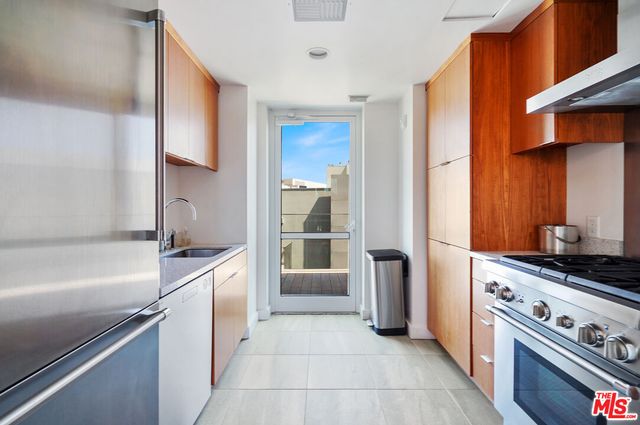 a kitchen with a stove and a refrigerator