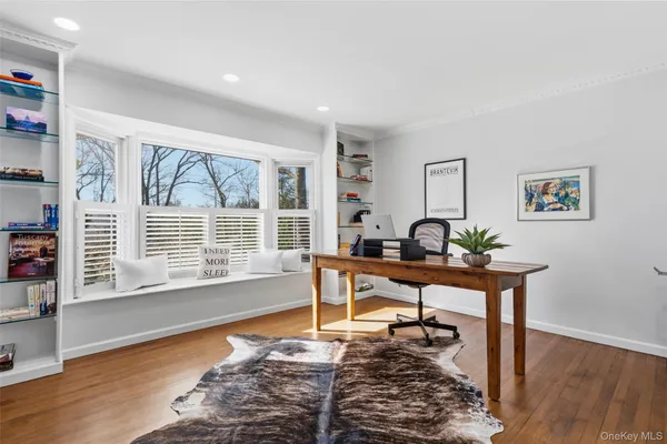 a bedroom with a bed and cabinets