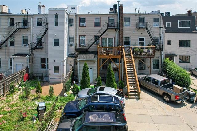 296 Paterson Plank Road Jersey City, NJ 07307 - Photo 7 of 13 a car parked in front of a buildings