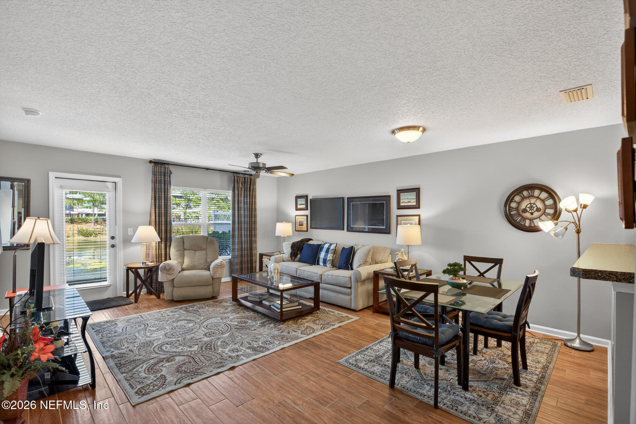 1500 Calming Water Drive, Unit 4603 Fleming Island, FL 32003 - Photo 15 of 98 a living room with furniture rug and window