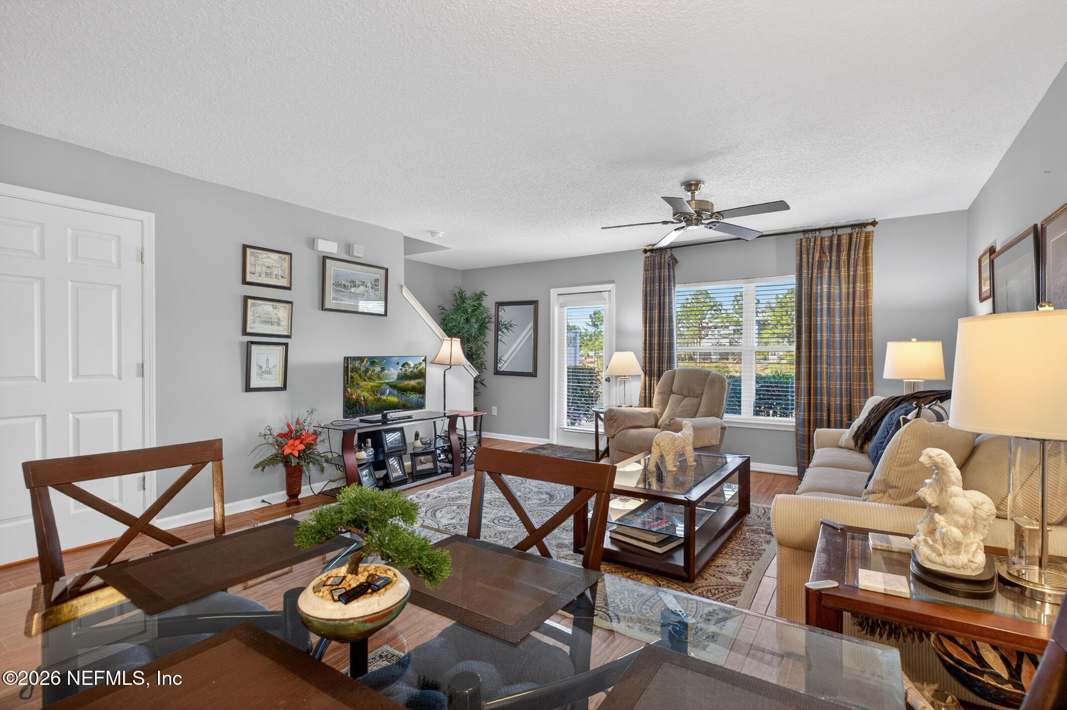1500 Calming Water Drive, Unit 4603 Fleming Island, FL 32003 - Photo 25 of 98 a living room with furniture and a large window