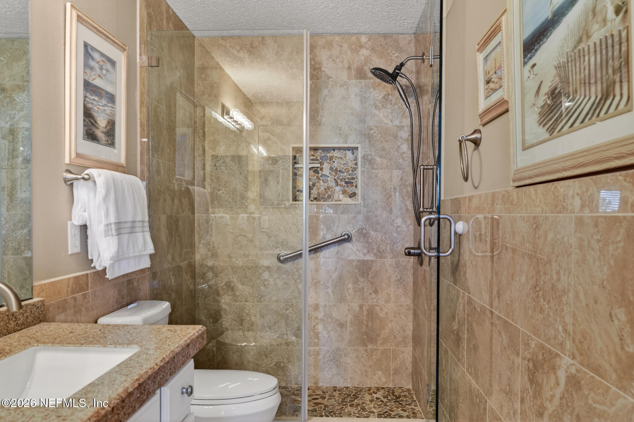 1500 Calming Water Drive, Unit 4603 Fleming Island, FL 32003 - Photo 39 of 98 a bathroom with a granite countertop sink toilet and shower