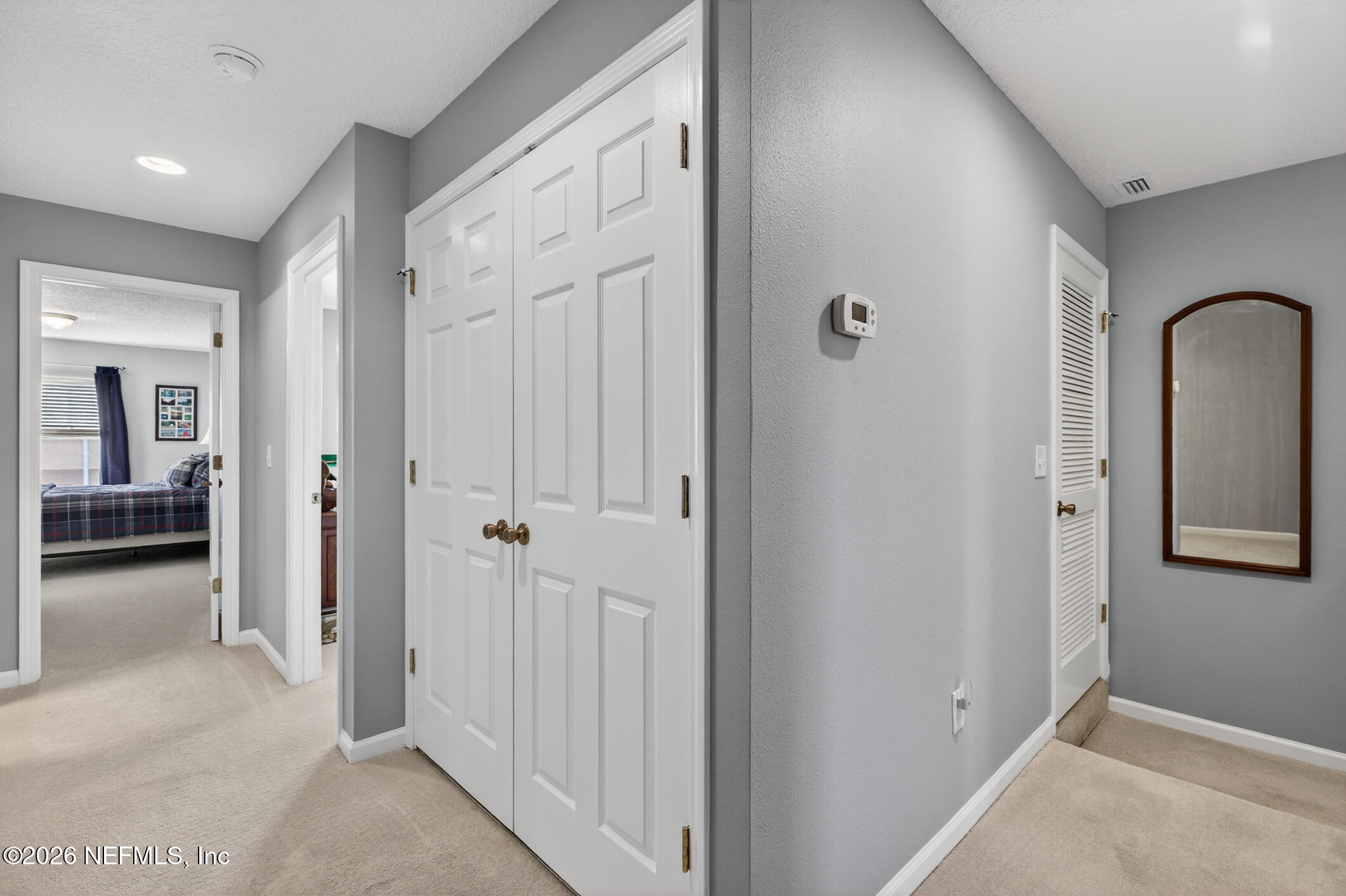 1500 Calming Water Drive, Unit 4603 Fleming Island, FL 32003 - Photo 40 of 98 a view of a livingroom from a hallway