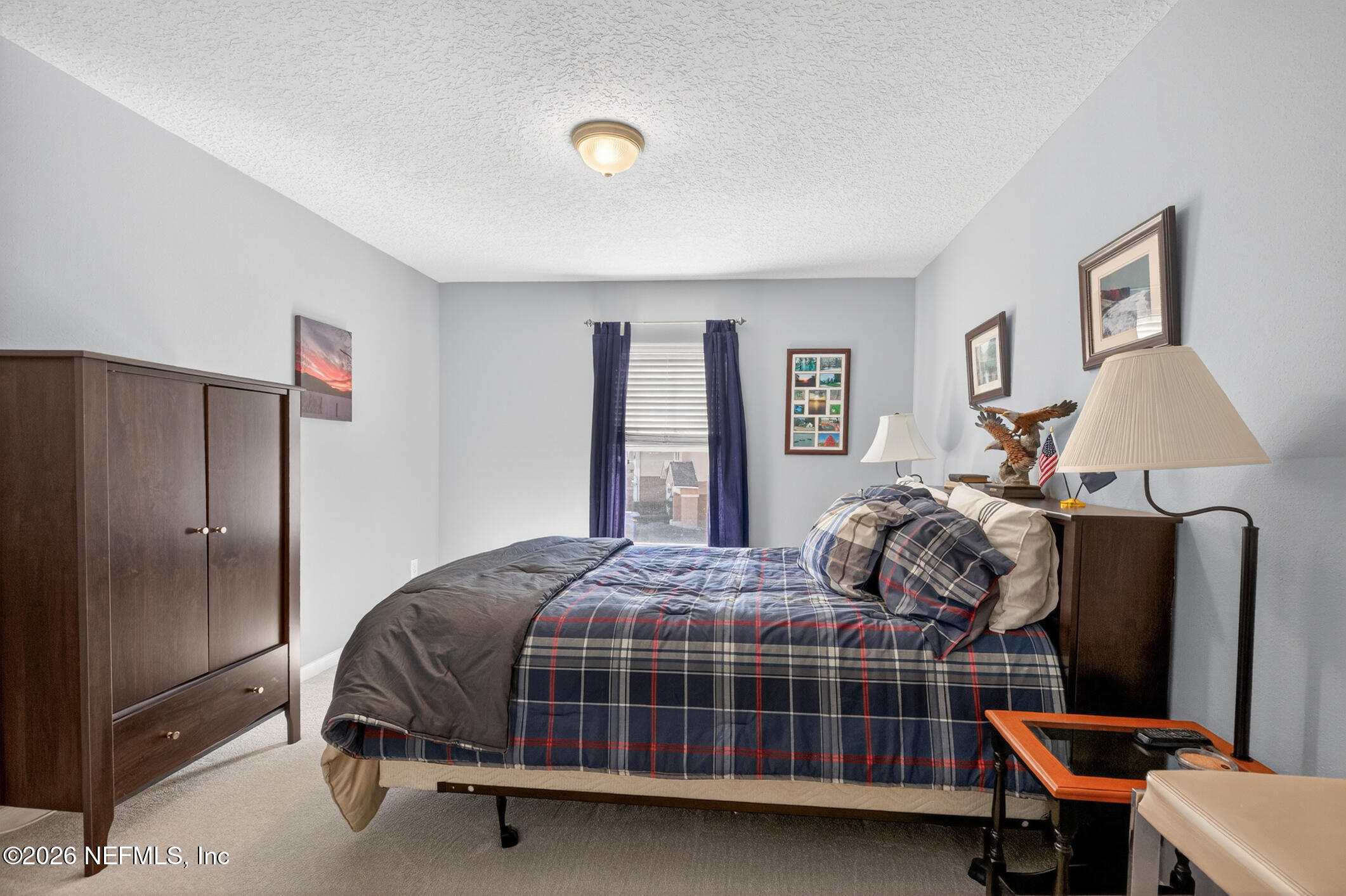 1500 Calming Water Drive, Unit 4603 Fleming Island, FL 32003 - Photo 45 of 98 a bedroom with bed and a window