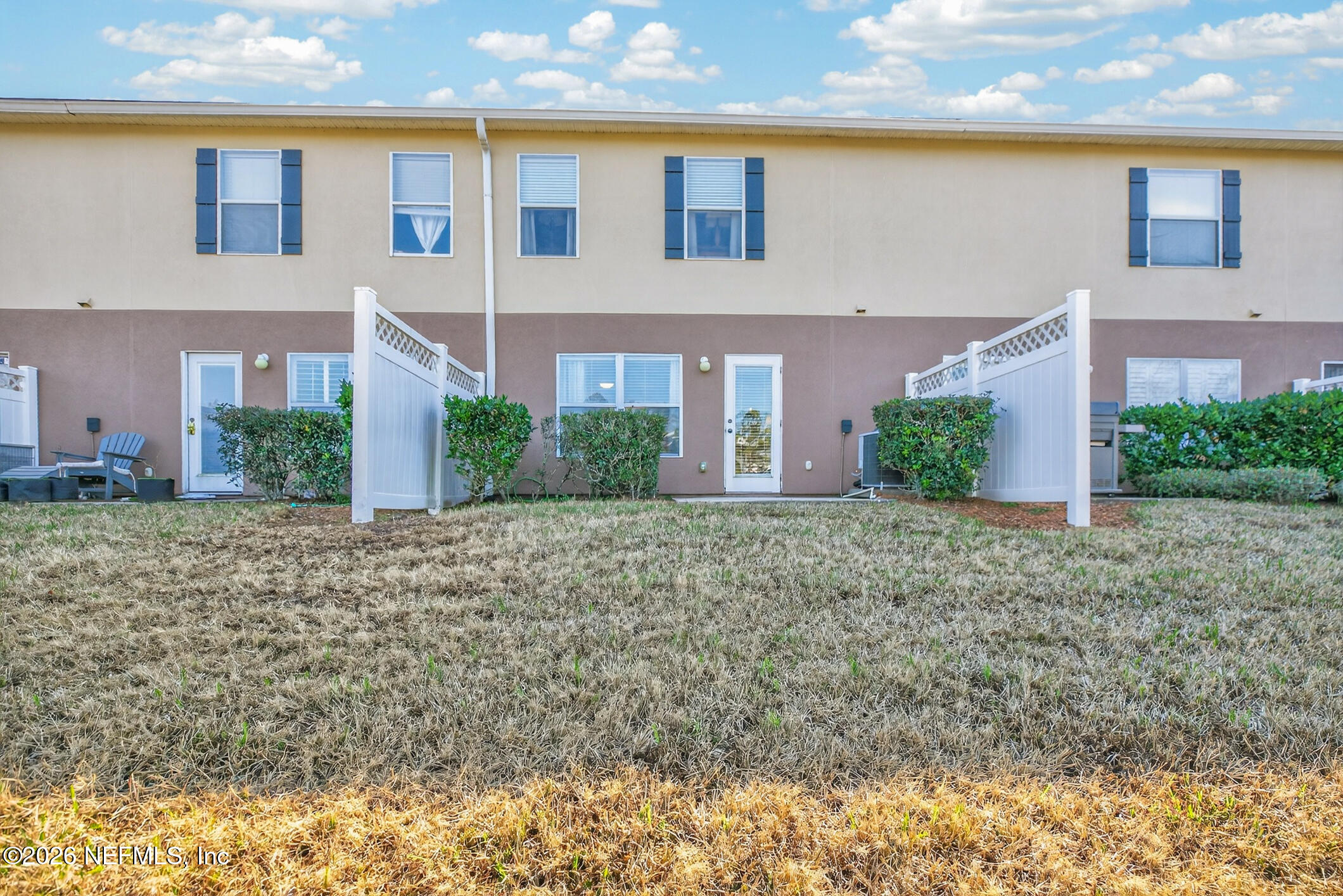 1500 Calming Water Drive, Unit 4603 Fleming Island, FL 32003 - Photo 52 of 98 a front view of a house with garden