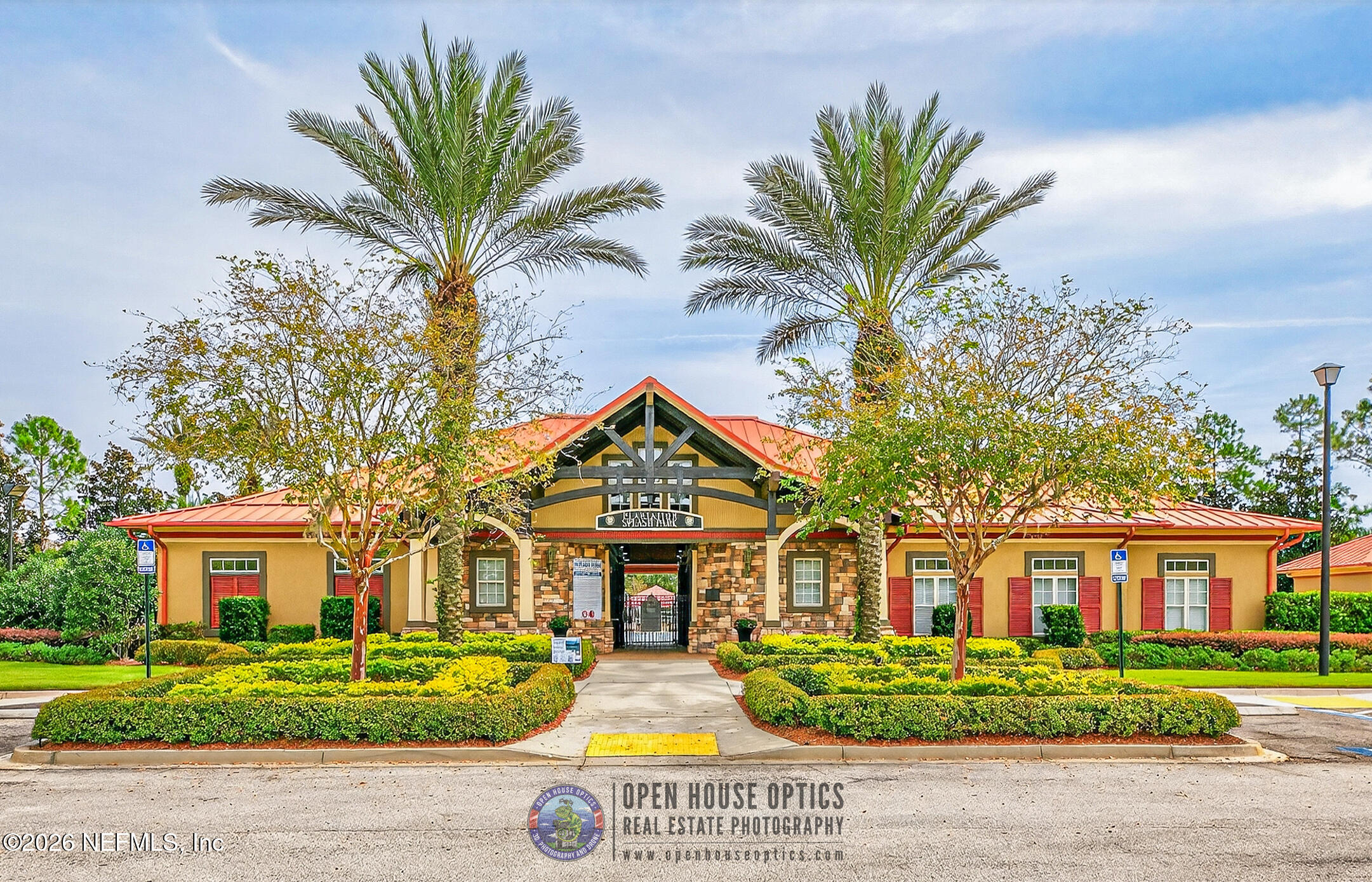 1500 Calming Water Drive, Unit 4603 Fleming Island, FL 32003 - Photo 58 of 98 a front view of a house with a garden and trees