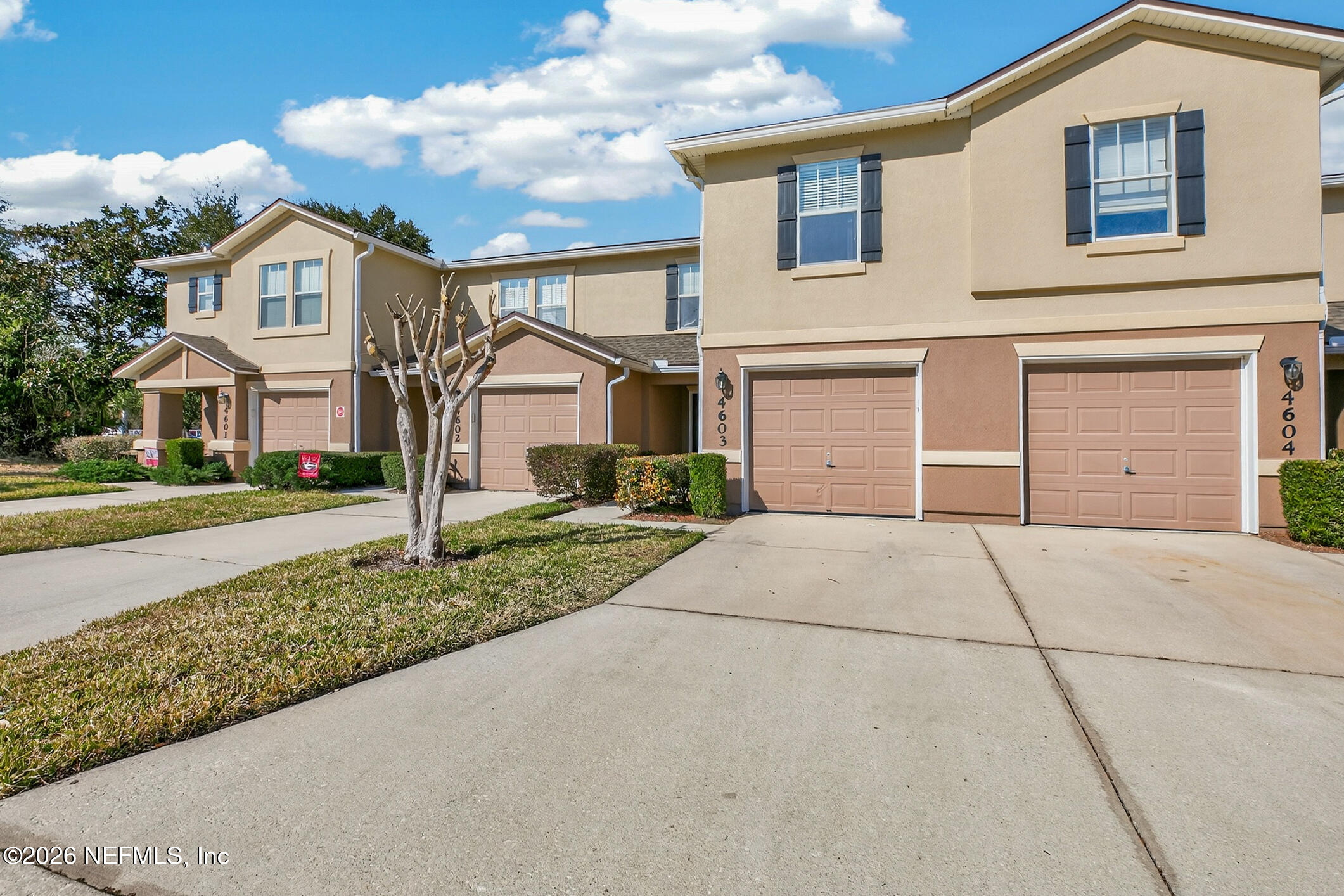 1500 Calming Water Drive, Unit 4603 Fleming Island, FL 32003 - Photo 6 of 98 a view of garage yard and front view of a house