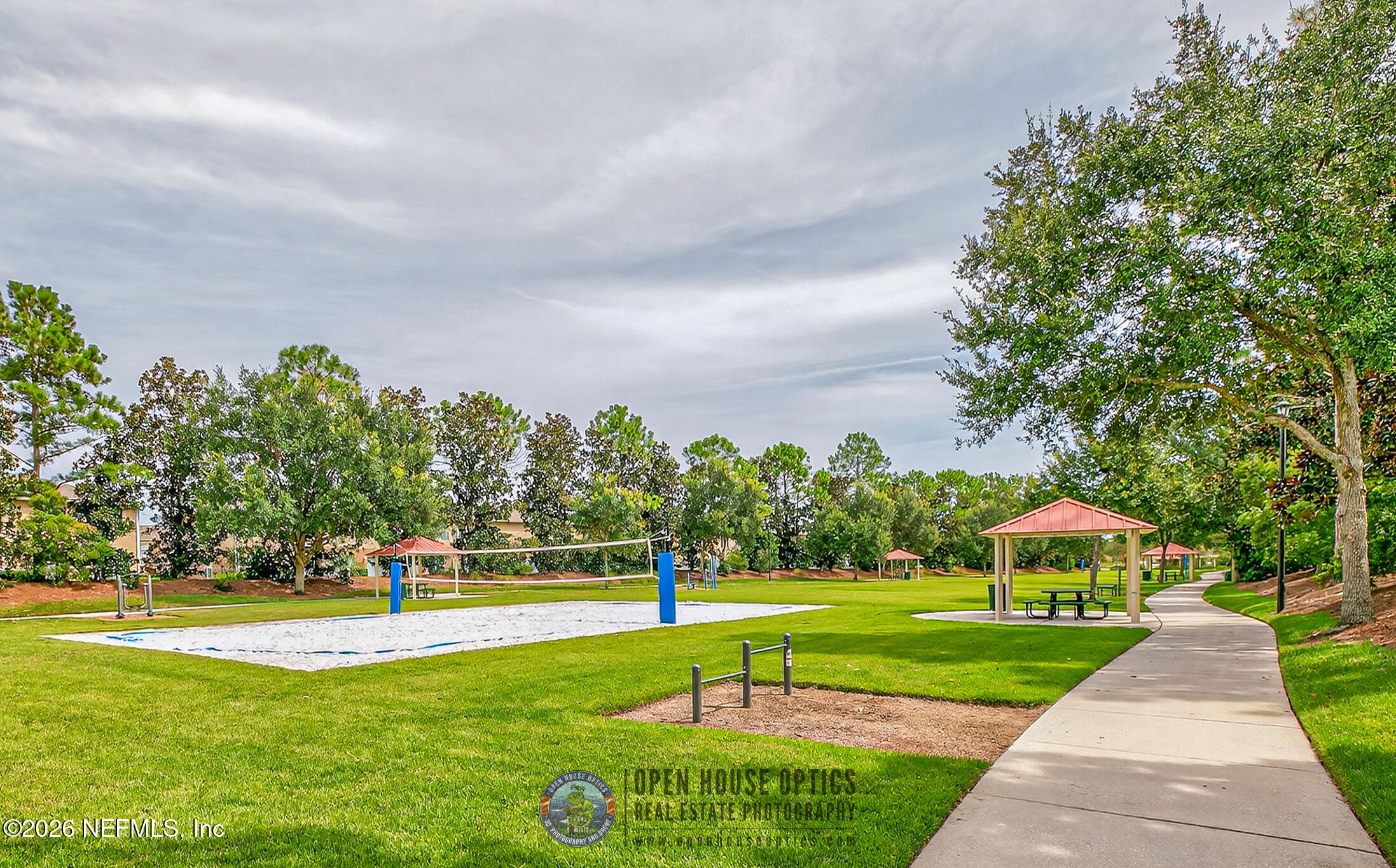 1500 Calming Water Drive, Unit 4603 Fleming Island, FL 32003 - Photo 68 of 98 a view of a fountain in front of a house with a big yard and potted plants