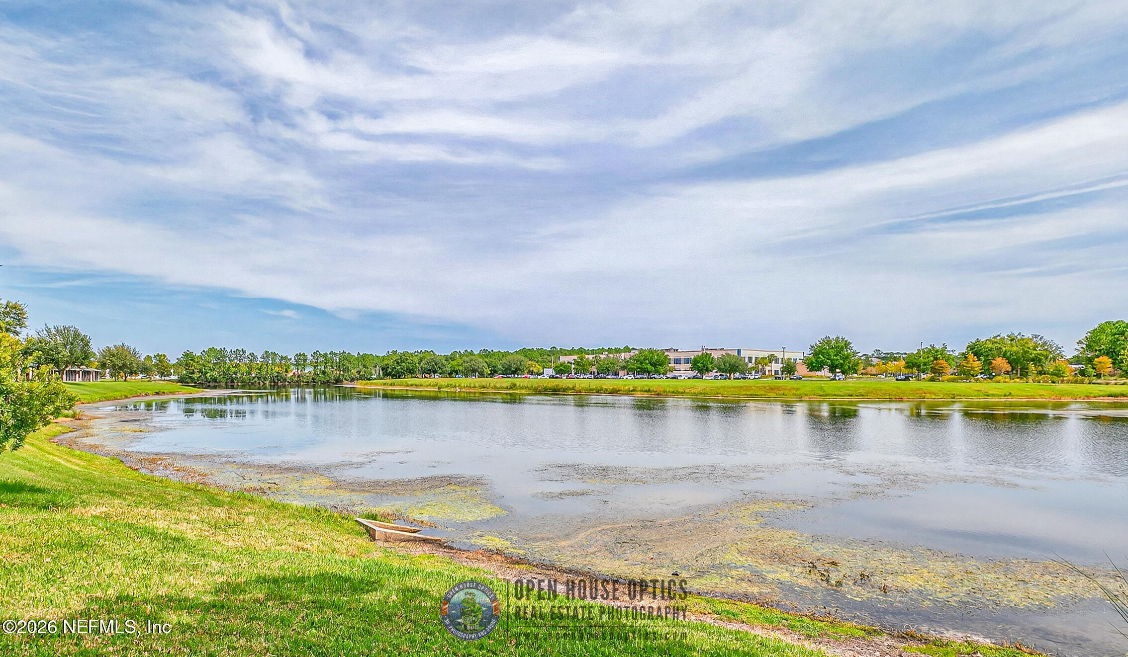 1500 Calming Water Drive, Unit 4603 Fleming Island, FL 32003 - Photo 73 of 98 a view of a lake with houses in the back