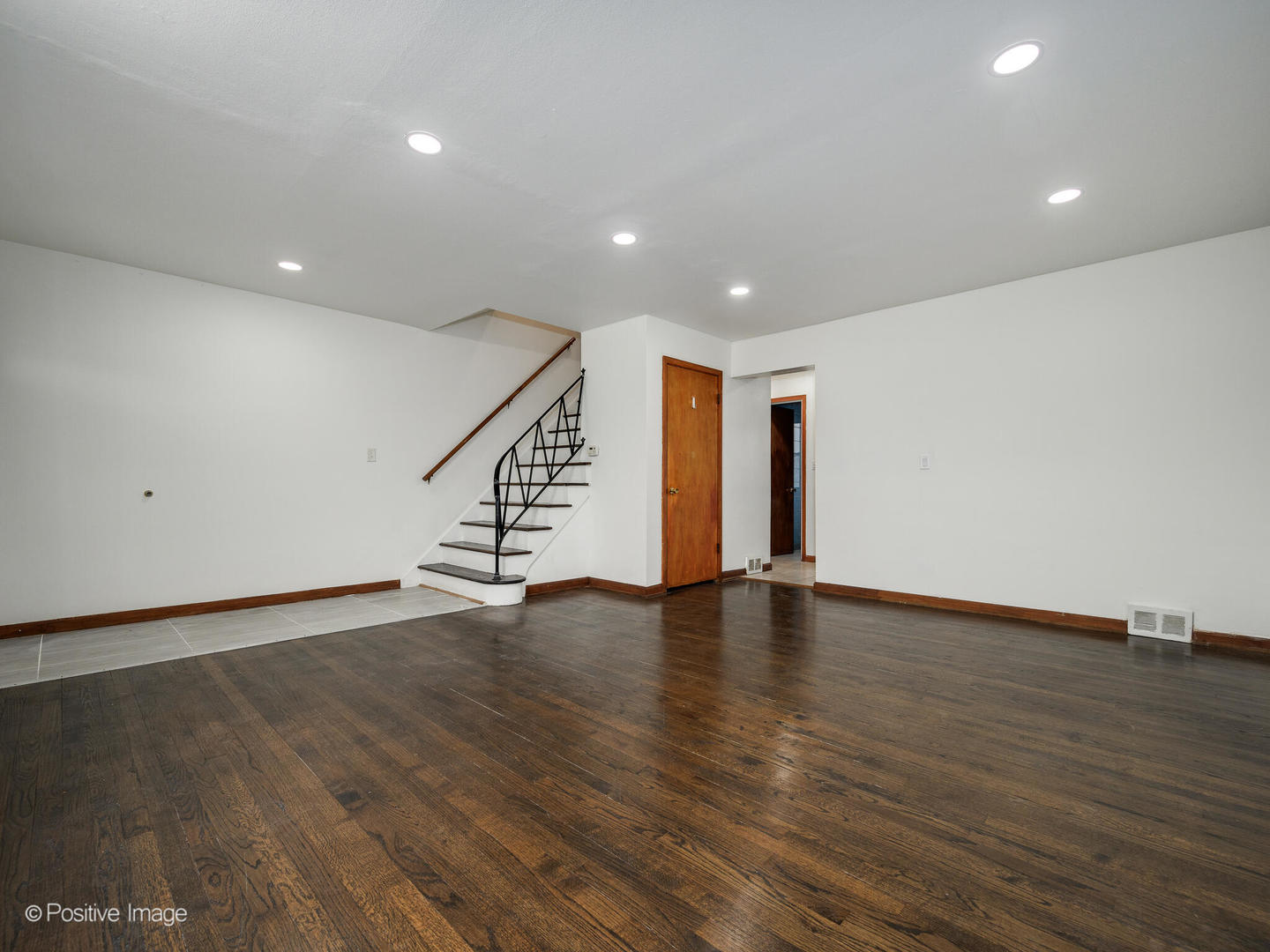 68 North Albert Street Mount Prospect, IL 60056 - Photo 2 of 15 a view of an empty room with wooden floor and staircase