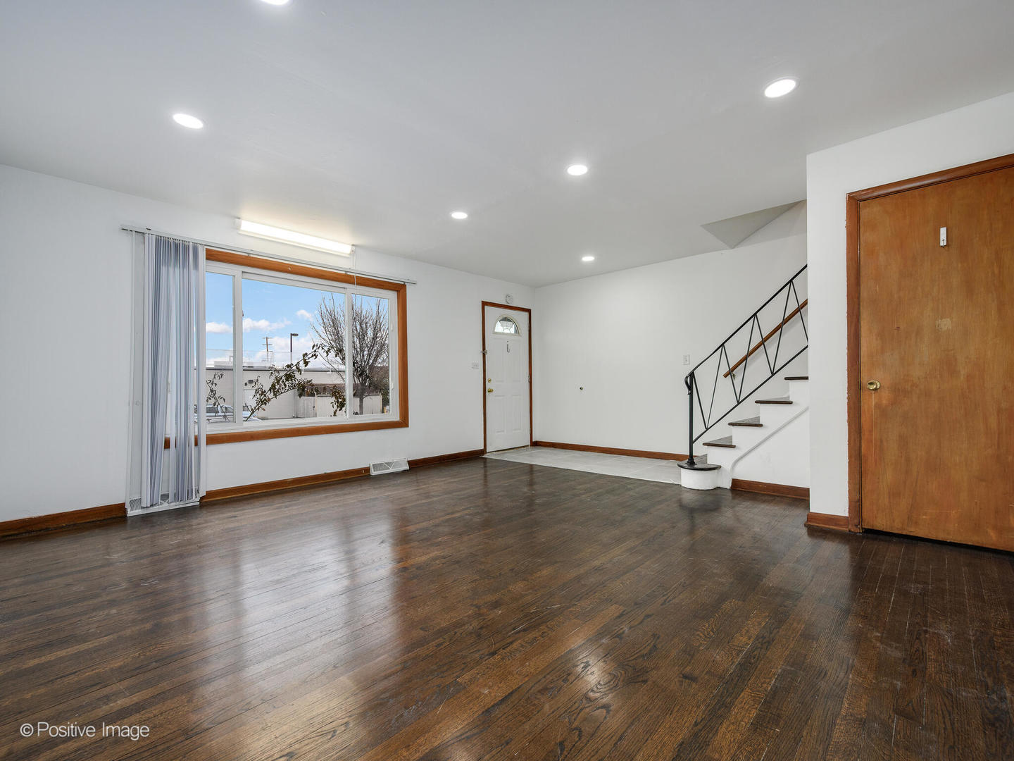 68 North Albert Street Mount Prospect, IL 60056 - Photo 4 of 15 a view of an empty room with wooden floor and window