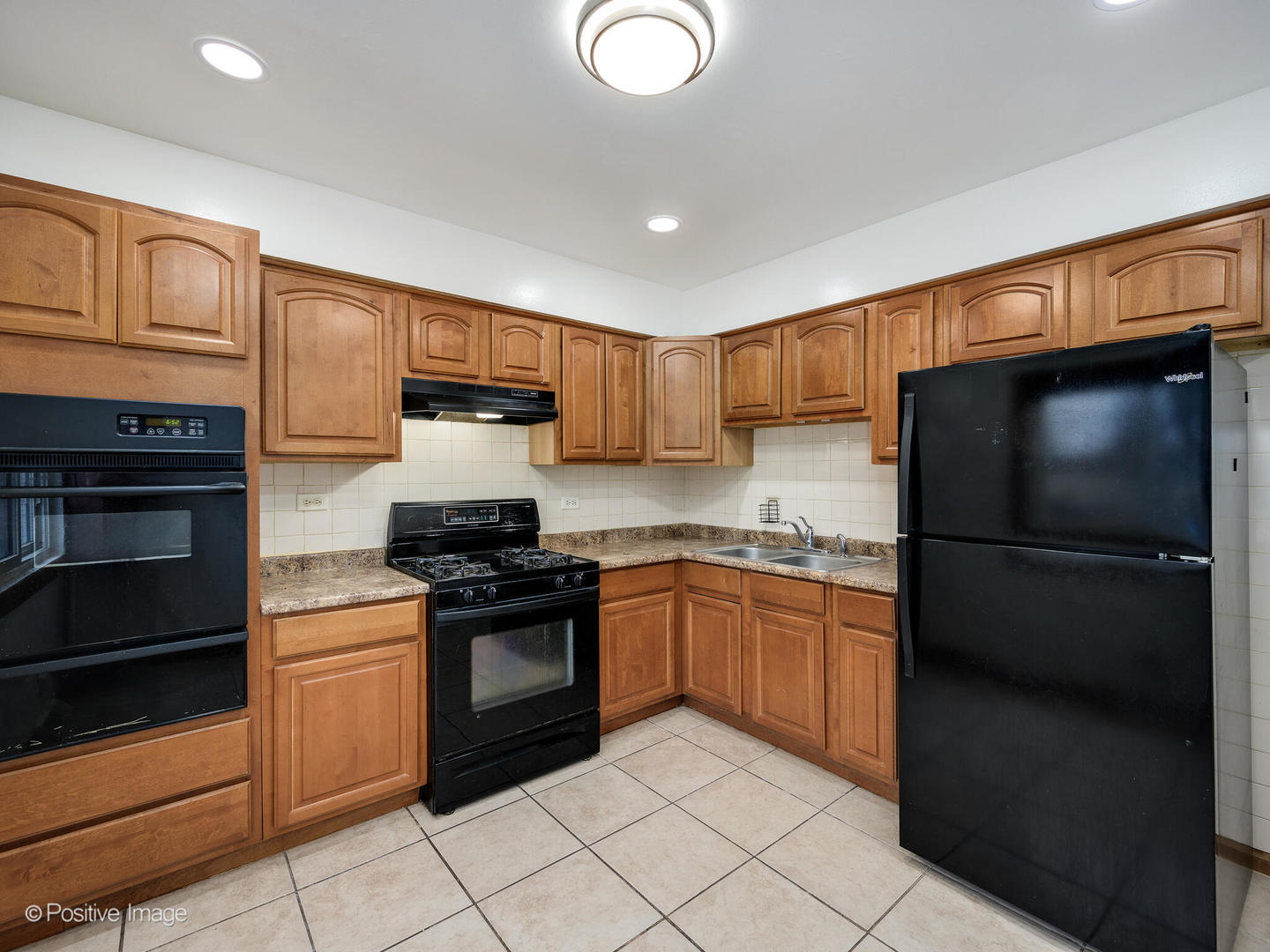 68 North Albert Street Mount Prospect, IL 60056 - Photo 5 of 15 a kitchen with stainless steel appliances granite countertop a refrigerator and a stove top oven