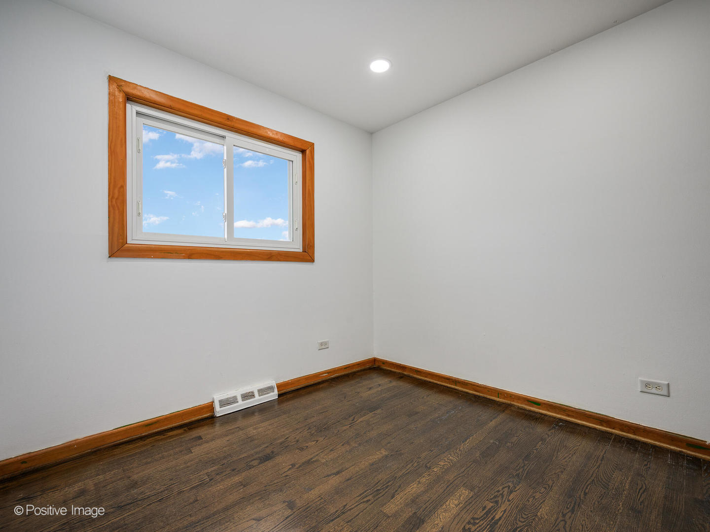 68 North Albert Street Mount Prospect, IL 60056 - Photo 8 of 15 a view of an empty room with wooden floor and a window