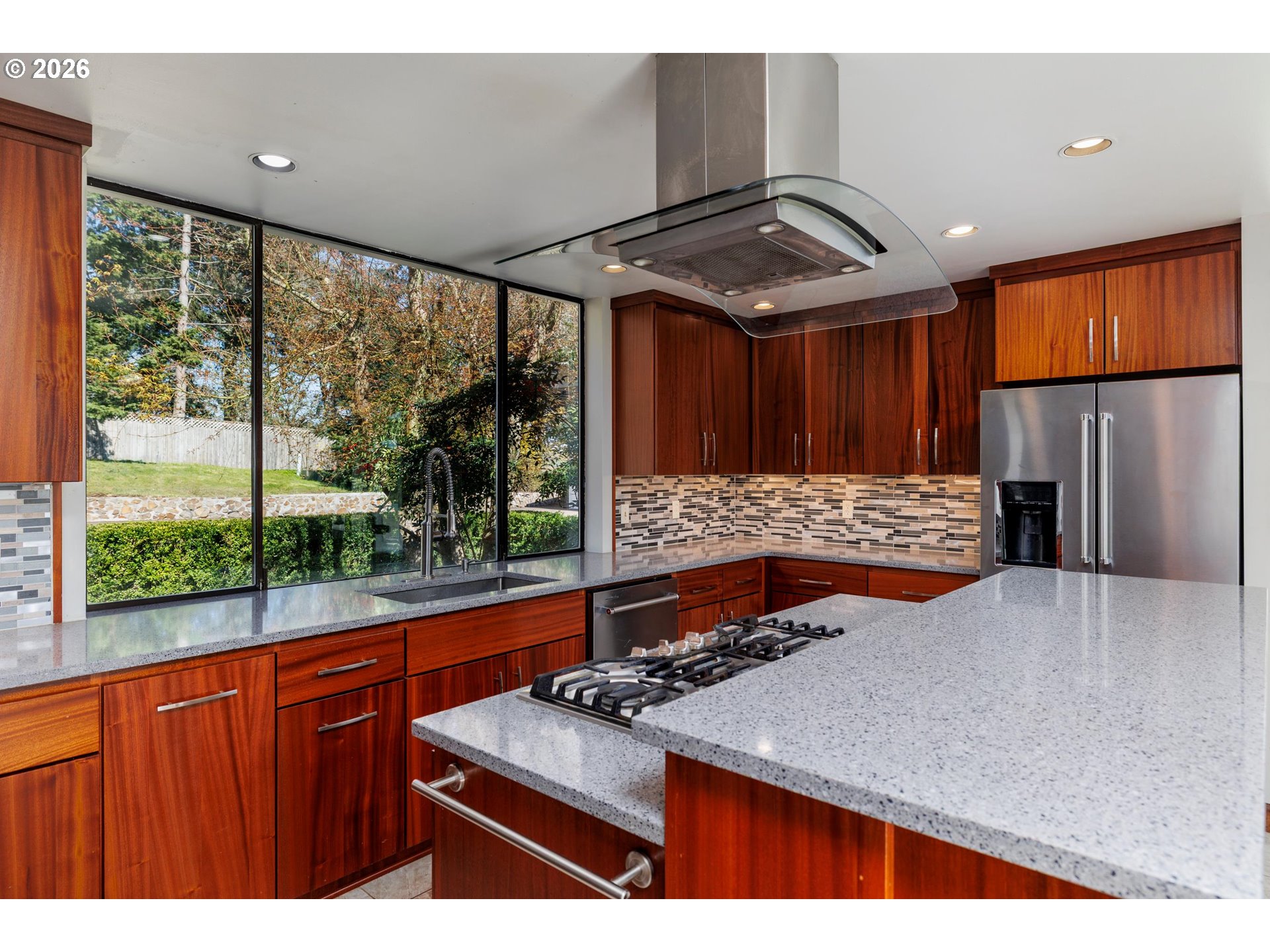 3251 Southwest Redmond Hill Road McMinnville, OR 97128 - Photo 12 of 46 a kitchen with stainless steel appliances granite countertop a sink and a wooden cabinets