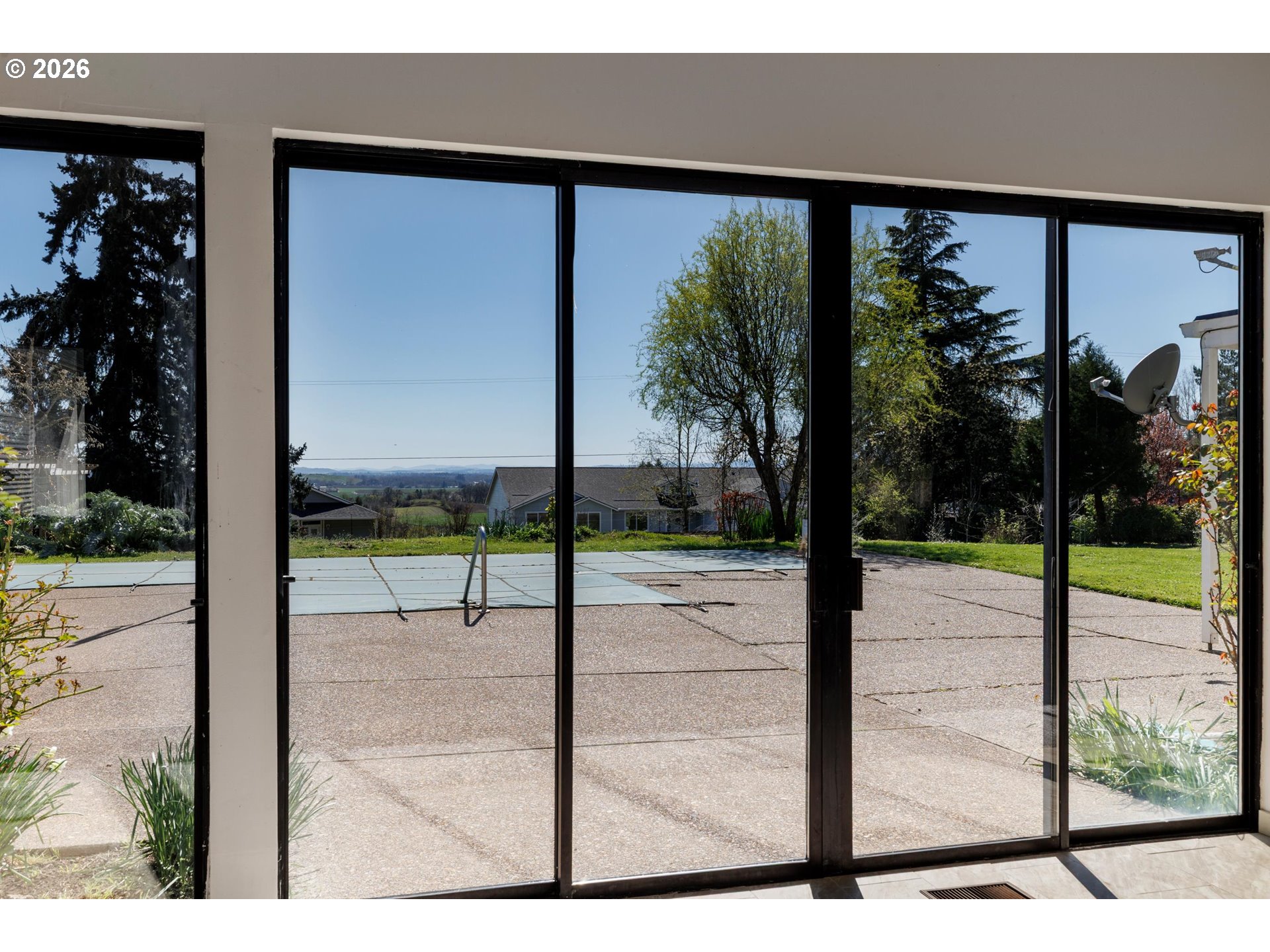 3251 Southwest Redmond Hill Road McMinnville, OR 97128 - Photo 20 of 46 a view of a porch with a floor to ceiling window and tree