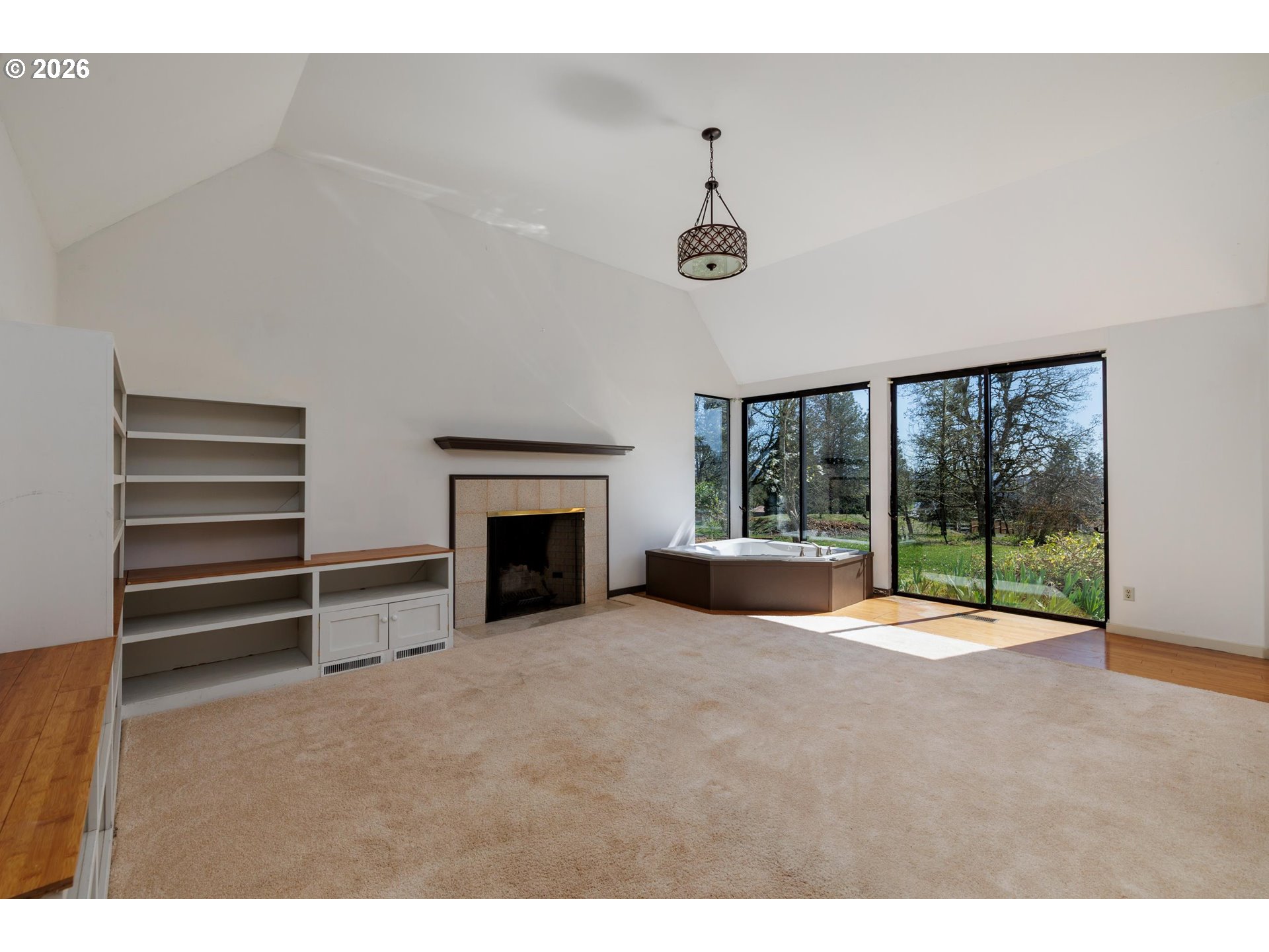 3251 Southwest Redmond Hill Road McMinnville, OR 97128 - Photo 23 of 46 a view of an empty room with a fireplace and a large window