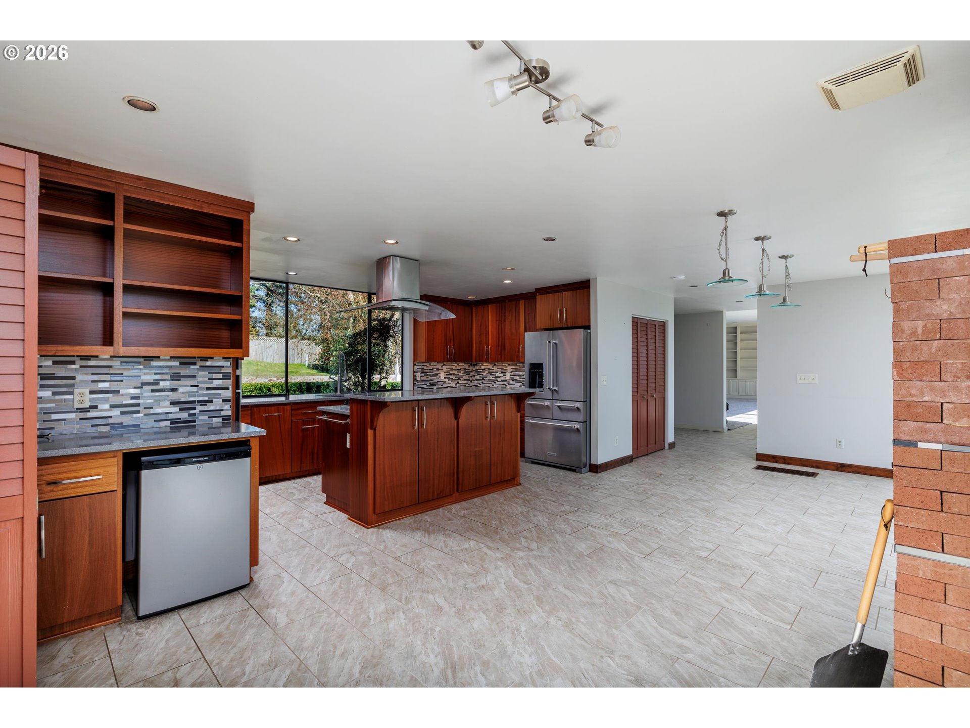 3251 Southwest Redmond Hill Road McMinnville, OR 97128 - Photo 10 of 46 a kitchen with kitchen island a counter top space a sink and cabinets