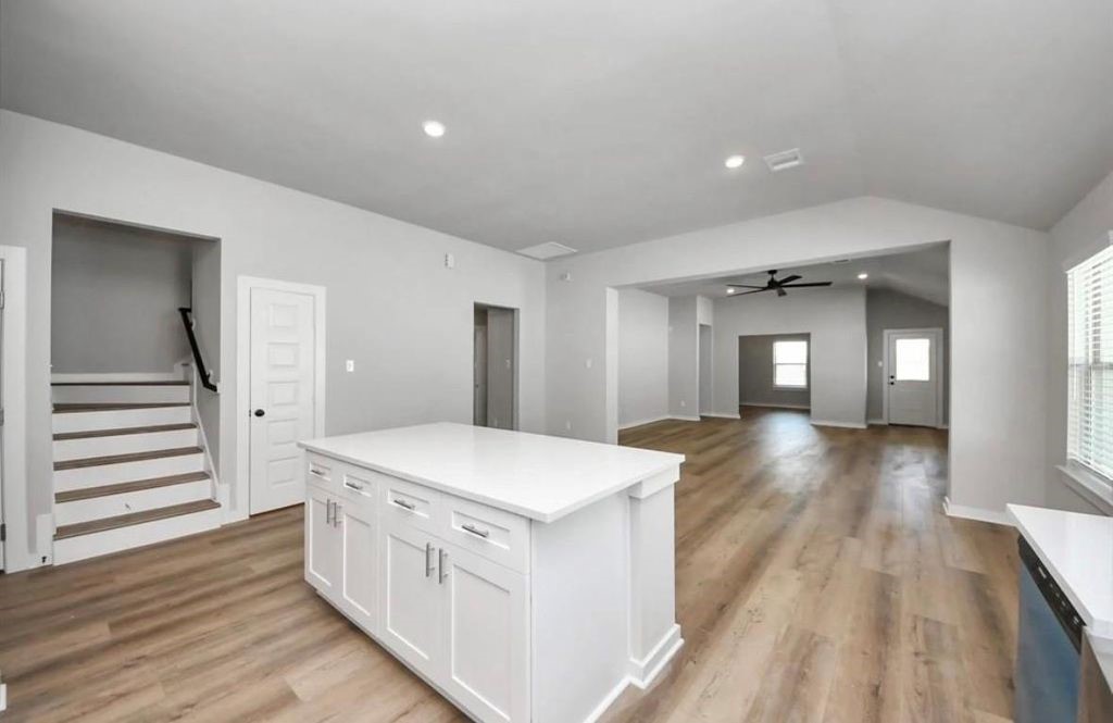 3527 Windmill Palm Drive Manvel, TX 77578 - Photo 4 of 13 a view of a hallway with wooden floor and staircase