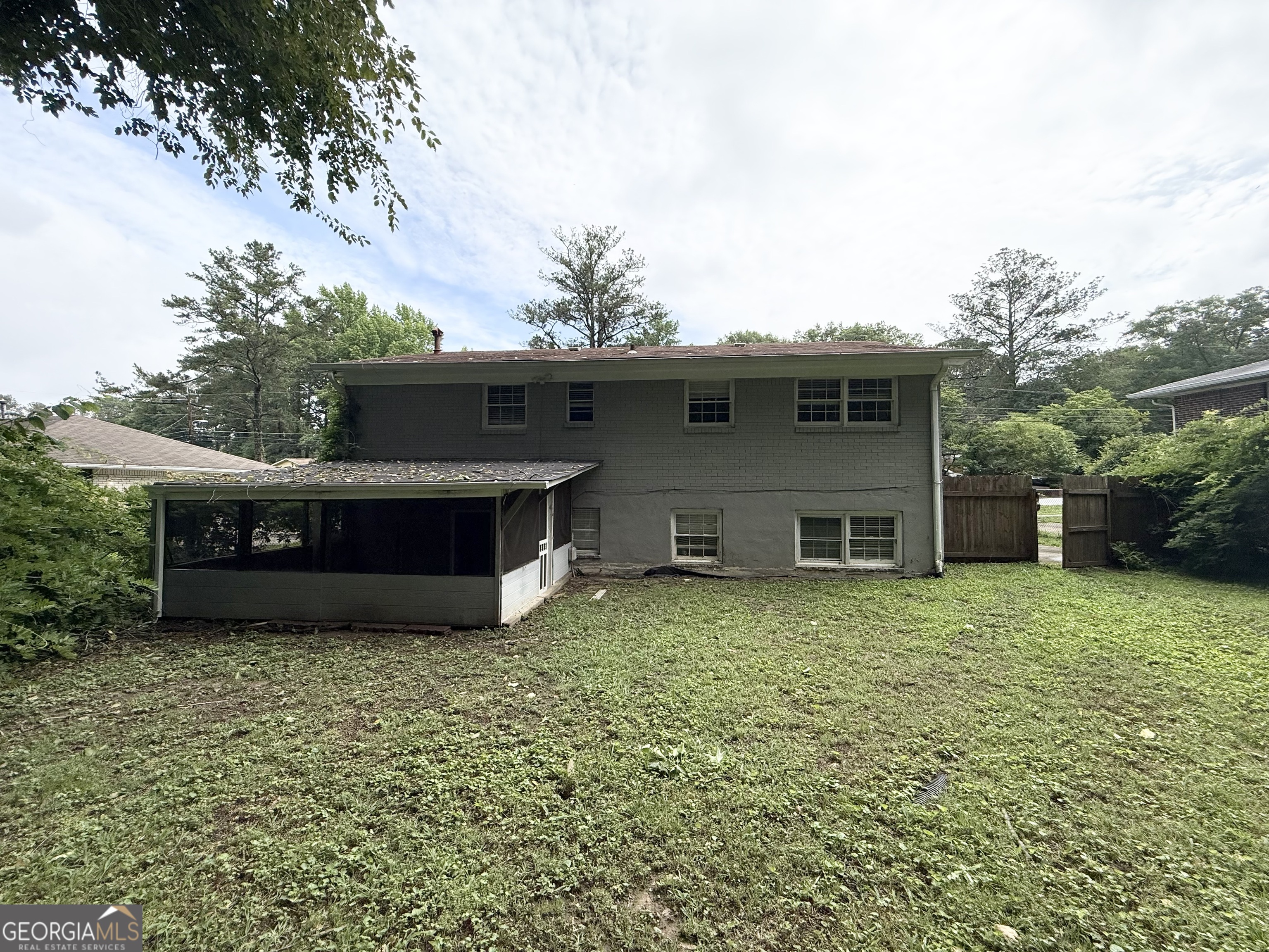 2782 Ocean Valley Road Atlanta, GA 30349 - Photo 27 of 27 a backyard of a house with yard and garage