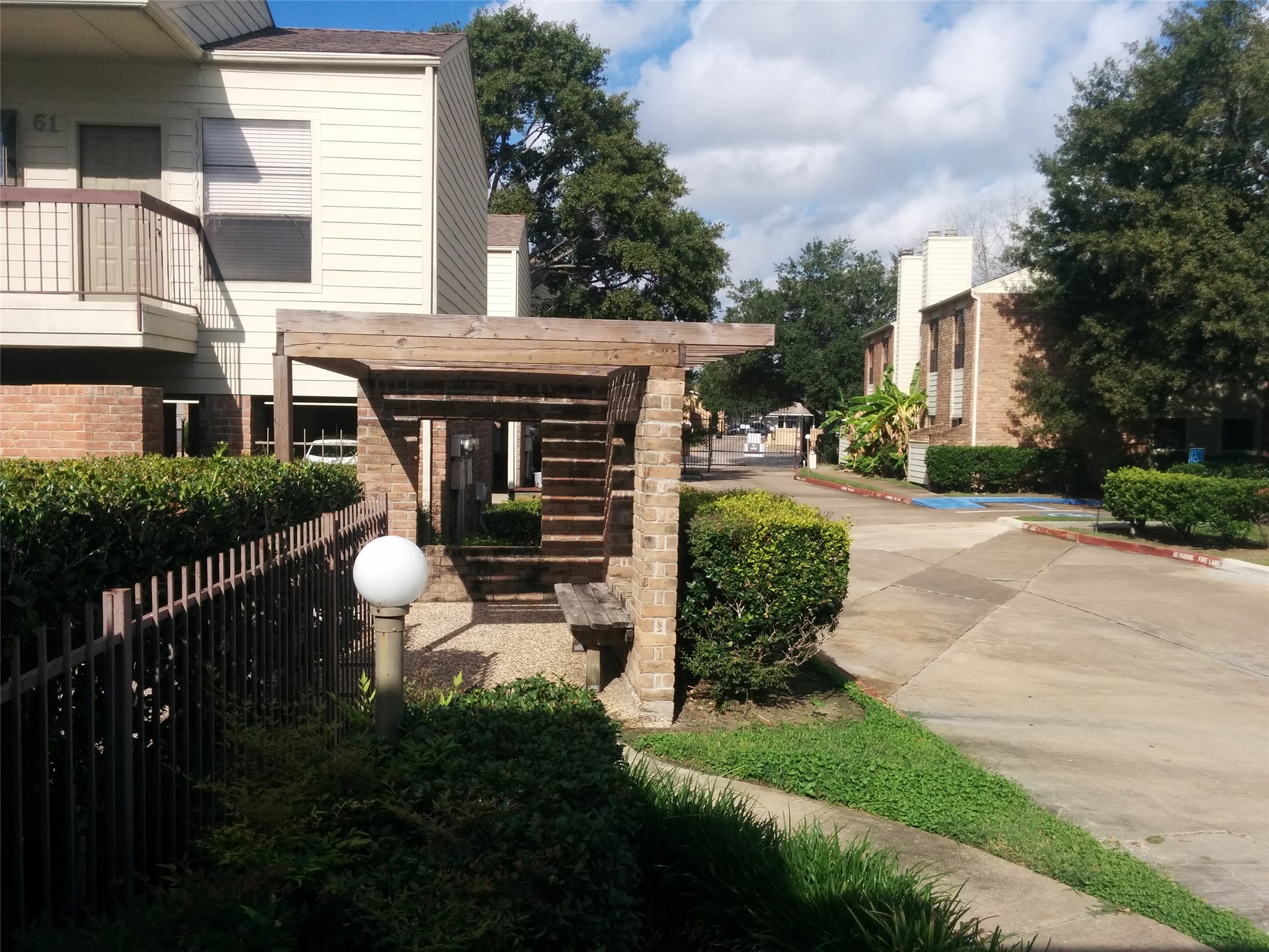 7901 Cambridge Street, Unit 68 Houston, TX 77054 - Photo 4 of 7 a front view of a house with garden