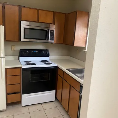 a kitchen with a stove and a microwave