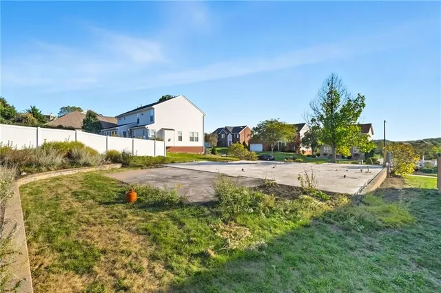 a view of yard with swimming pool and outdoor seating