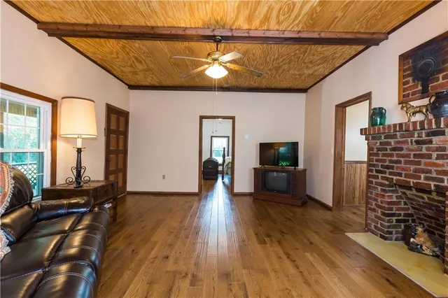 a view of a livingroom with furniture and a flat screen tv