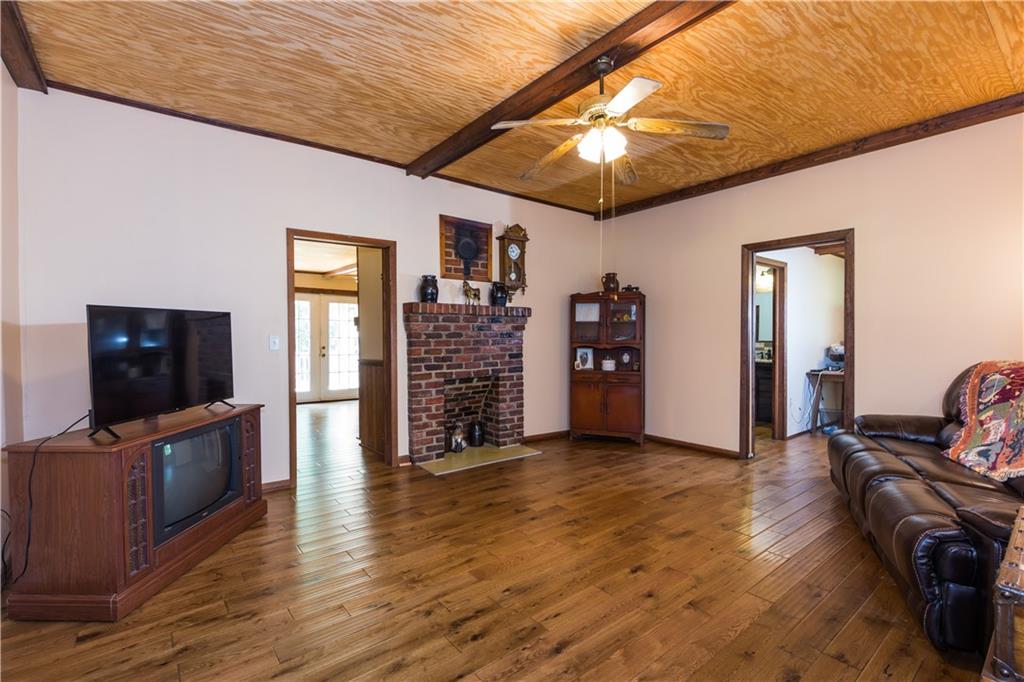 933 Alto-Mud Creek Road Alto, GA 30510 - Photo 12 of 41 a view of a livingroom with furniture and a flat screen tv