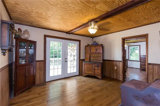 a view of kitchen with furniture and wooden floor