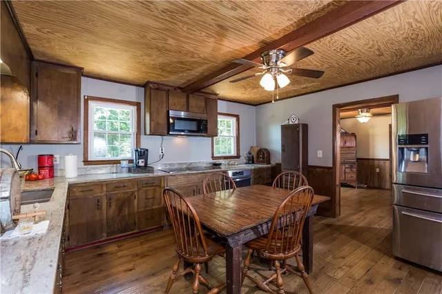 a kitchen with a sink stove and microwave