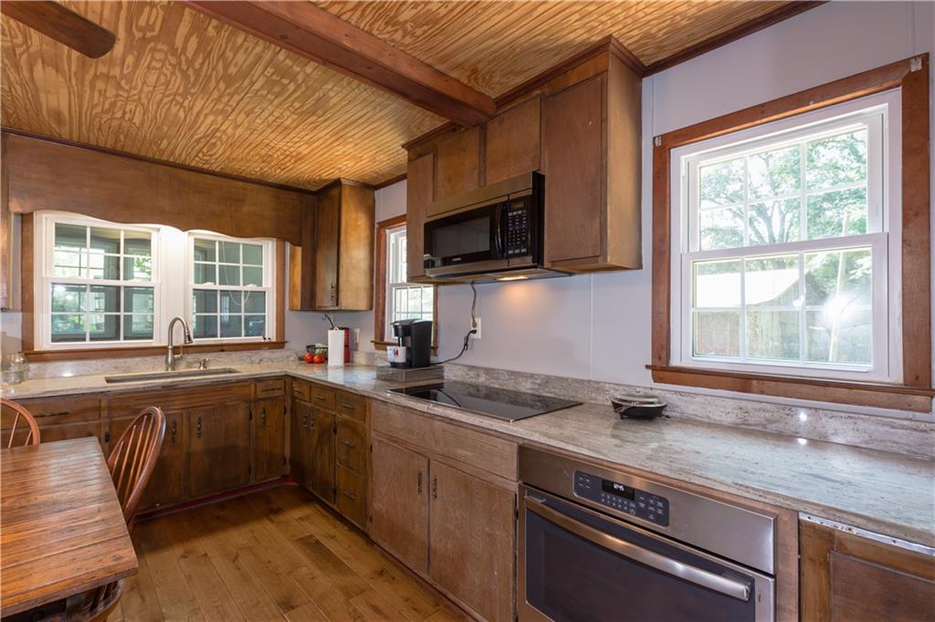 933 Alto-Mud Creek Road Alto, GA 30510 - Photo 19 of 41 a kitchen with a sink stove and microwave