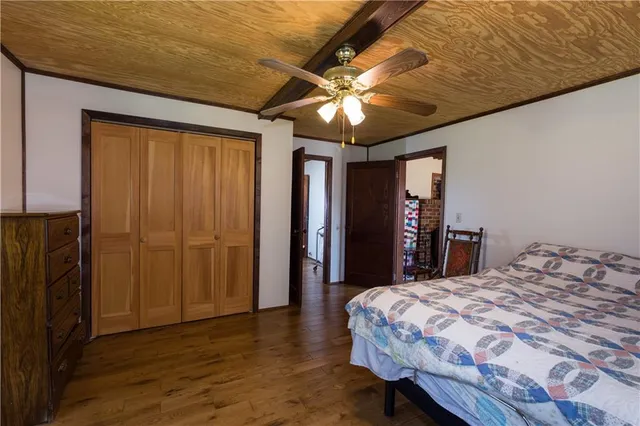 a en suite bathroom with a granite countertop sink and a mirror