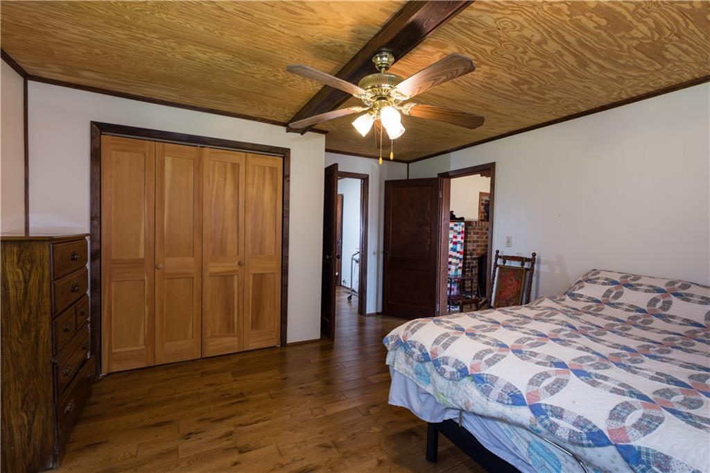 933 Alto-Mud Creek Road Alto, GA 30510 - Photo 23 of 41 a bedroom with a bed and a chandelier