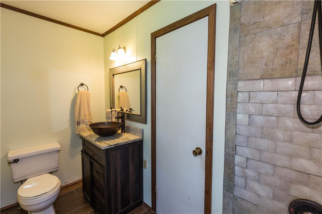 933 Alto-Mud Creek Road Alto, GA 30510 - Photo 26 of 41 a bathroom with a sink a toilet and shower