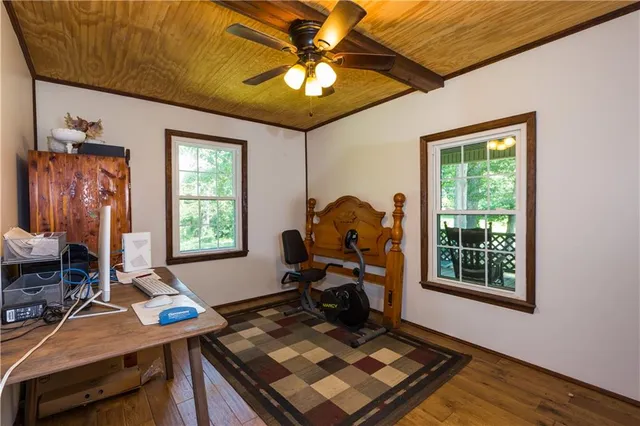 a bedroom with furniture and a window