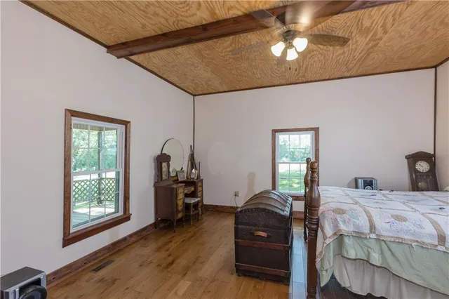 a bed room with a bed and a television