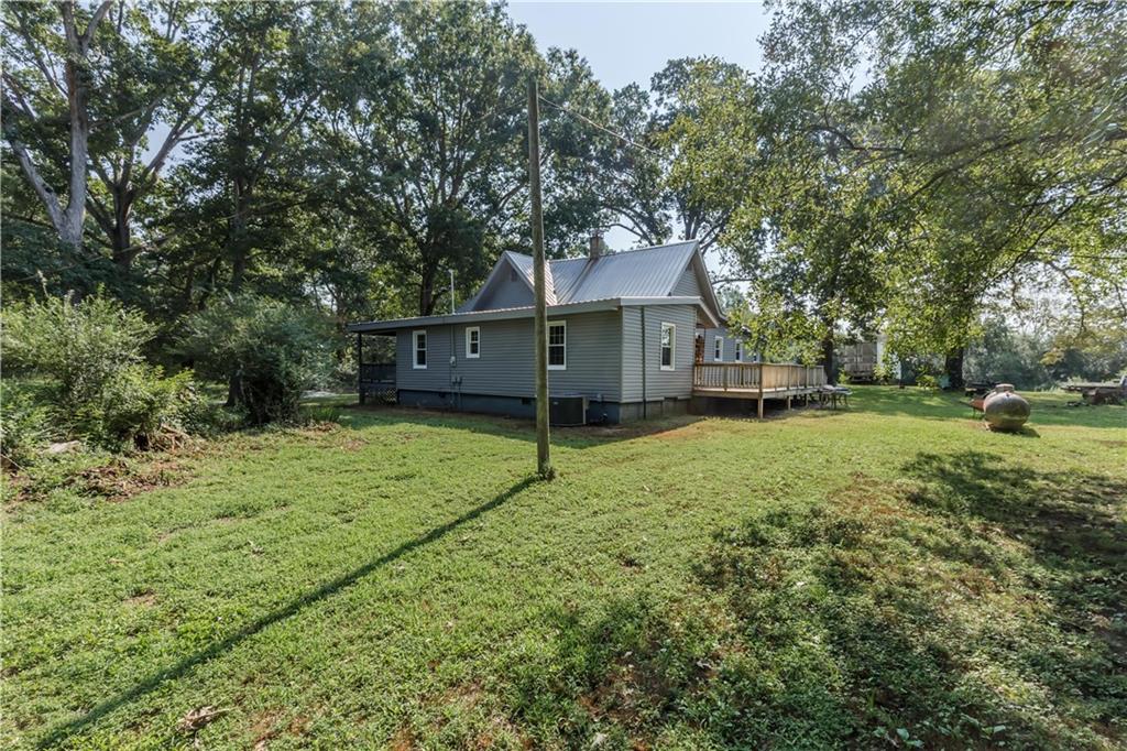 933 Alto-Mud Creek Road Alto, GA 30510 - Photo 35 of 41 a view of a house with a backyard and a tree