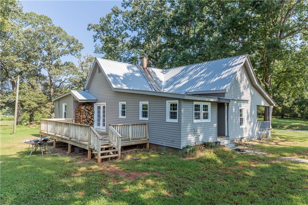 933 Alto-Mud Creek Road Alto, GA 30510 - Photo 7 of 41 a view of a house with a yard and deck