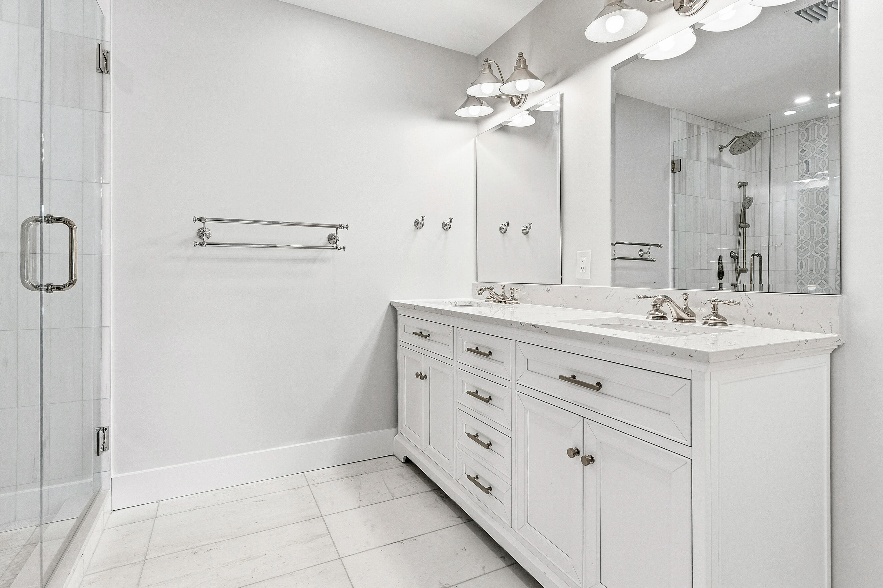 1254 Southwest 4th Court Boca Raton, FL 33432 - Photo 17 of 35 a bathroom with a double vanity sink a mirror and a shower