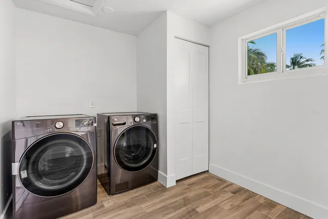 a view of a hallway with washer and dryer