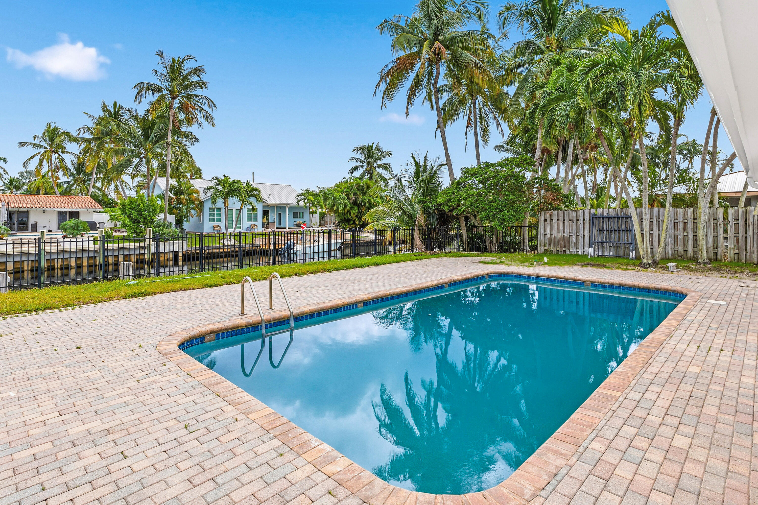 1254 Southwest 4th Court Boca Raton, FL 33432 - Photo 21 of 35 a swimming pool with outdoor seating and yard