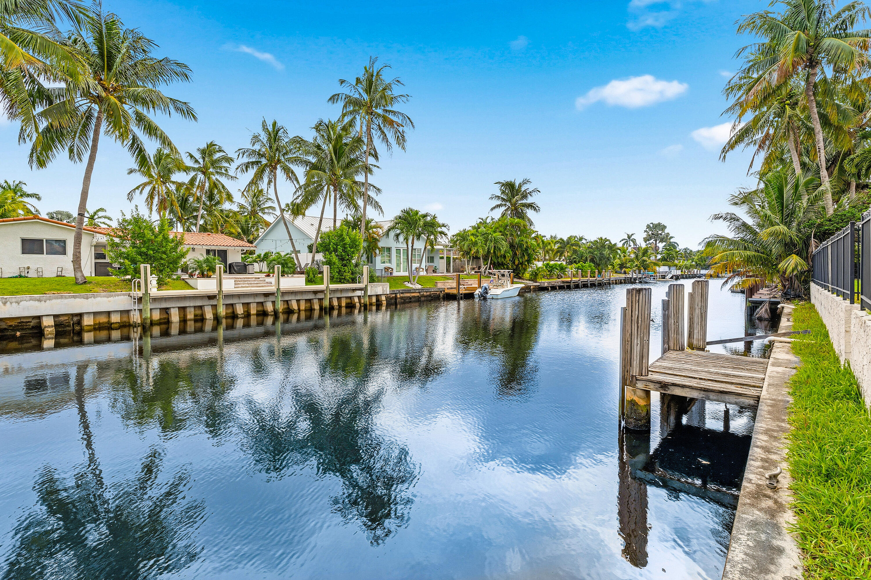 1254 Southwest 4th Court Boca Raton, FL 33432 - Photo 23 of 35 a view of a lake with a yard and potted plants