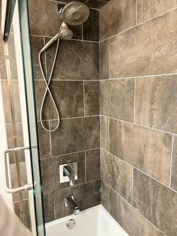 a bathroom with a sink toilet and a shower