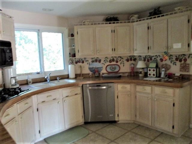 575 Baintree Road Lake Summerset, IL 61019 - Photo 3 of 43 a kitchen with stainless steel appliances granite countertop a sink window and cabinets