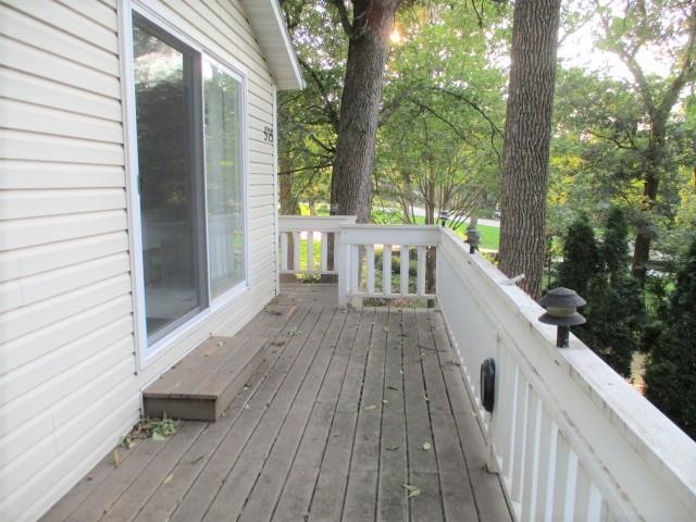 575 Baintree Road Lake Summerset, IL 61019 - Photo 31 of 43 a view of balcony and deck with wooden floor and fence