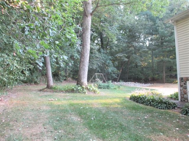 575 Baintree Road Lake Summerset, IL 61019 - Photo 35 of 43 a view of a yard with a tree