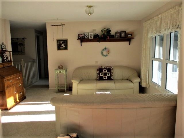 575 Baintree Road Lake Summerset, IL 61019 - Photo 9 of 43 a large white bed sitting in a bedroom next to a window